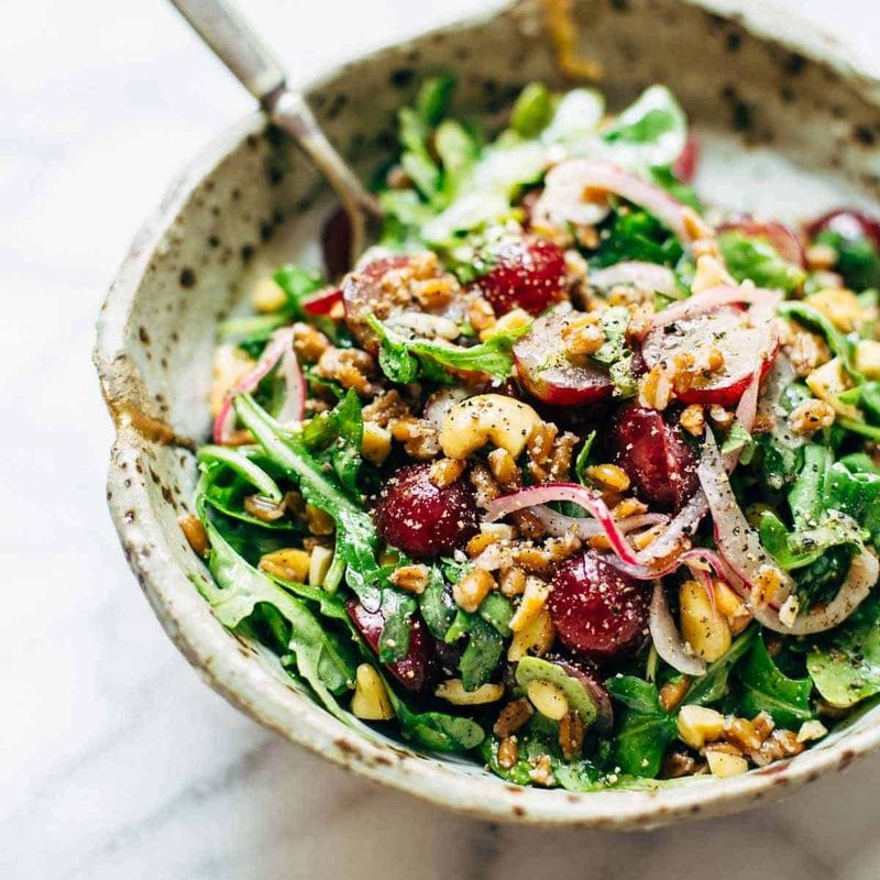 A picture of Arugula Salad with Grapes and Black Pepper Vinaigrette