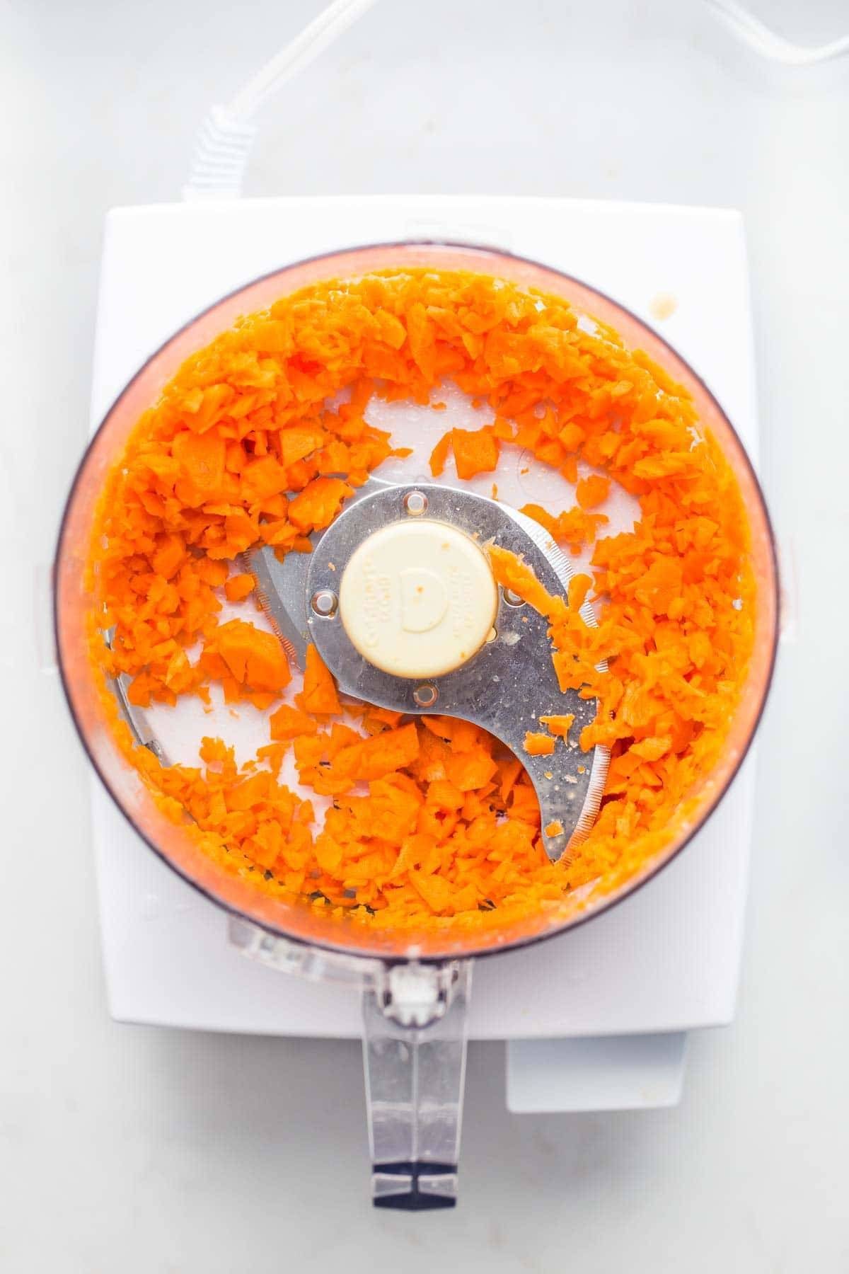 Carrots in a food processor.