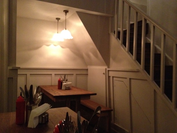 table for four under the stairs at Pitt Cue Soho table for four under the stairs at pittcue soho