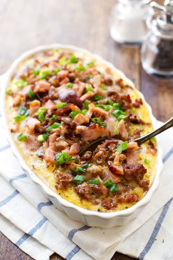 Ham and Sausage Hash Brown Egg Bake with a spoon on a napkin.