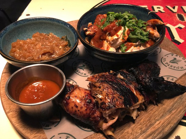 half rotisserie chicken at plaza pastor