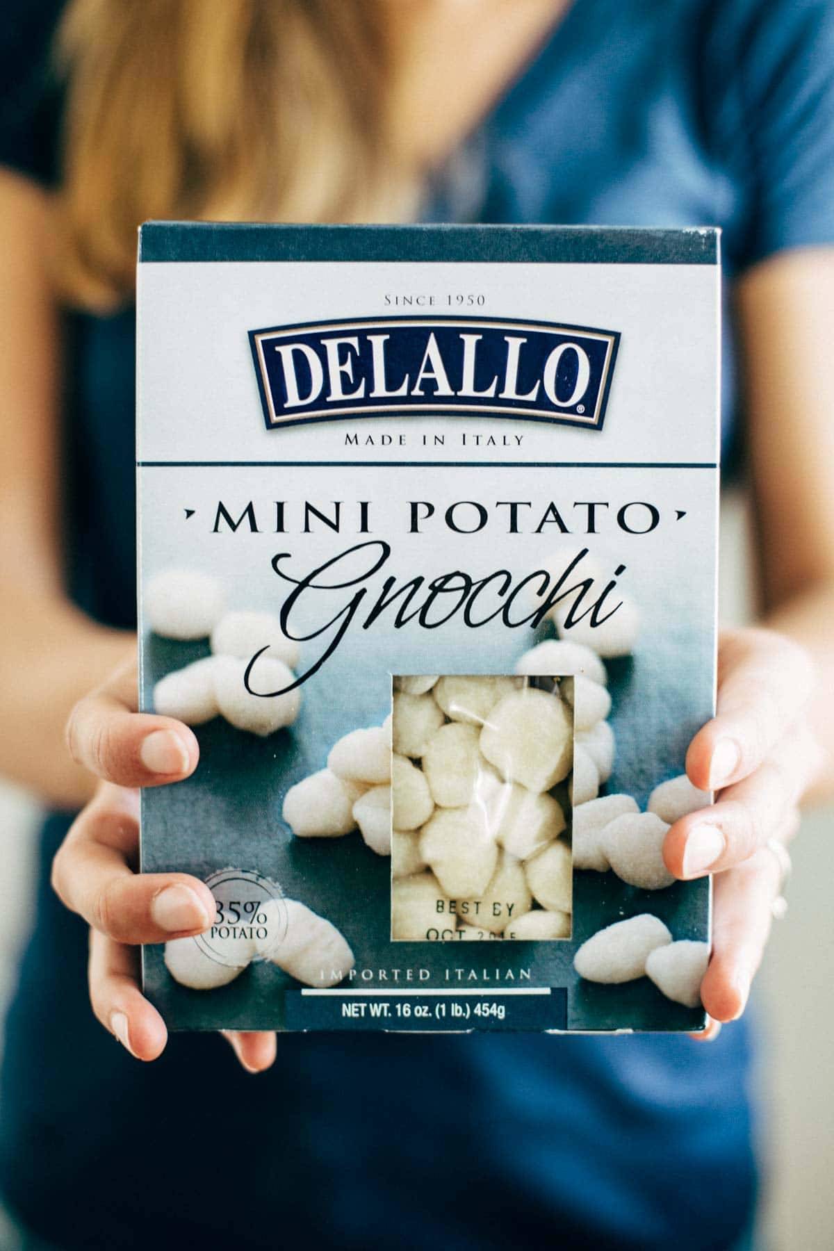 Mushroom Gnocchi with Walnut Pesto and Arugula - a vegetarian bowl that's made with familiar ingredients. Comes together in 30 minutes or less! | pinchofyum.com