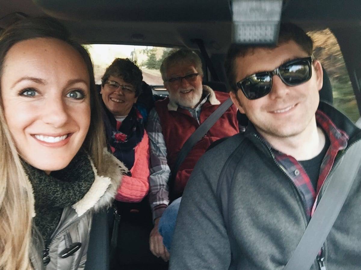 Four people in a vehicle.